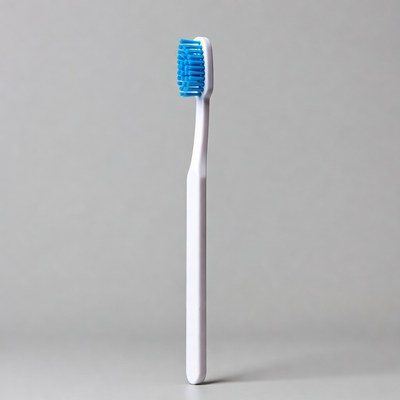 Blue bristled white toothbrush