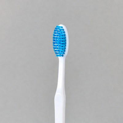 Blue Bristle Toothbrush on Gray Background