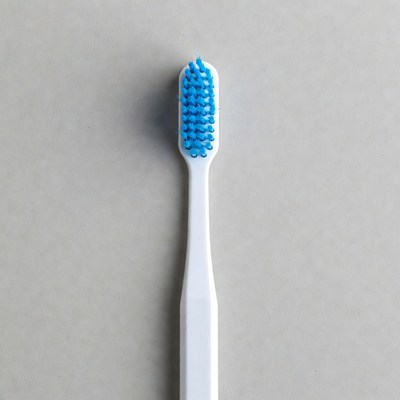 Blue toothbrush on white handle