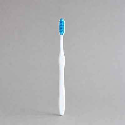 Blue toothbrush on gray background