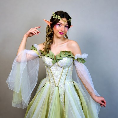 Woman in green elf costume