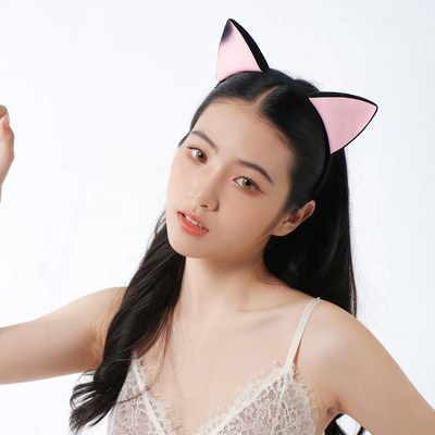Asian woman wearing pink cat ear headband