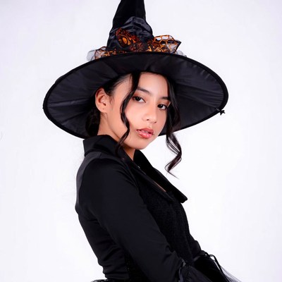 Asian woman in black witch hat