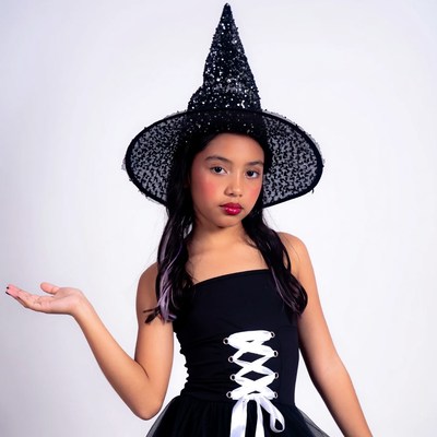 Asian girl in glittery witch hat