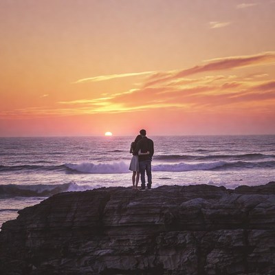 Couple embracing at sunset beach