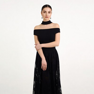 Woman in black off-shoulder lace dress