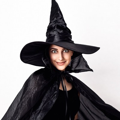 Woman in black witch hat and cape