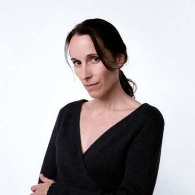 Woman in black sweater arms crossed