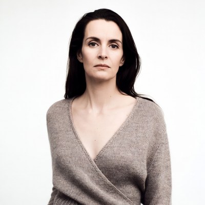 Woman in gray wrap sweater