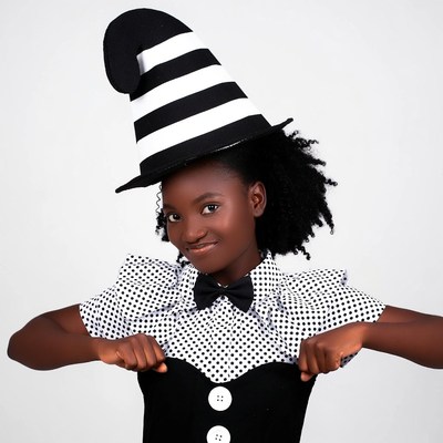 African girl in striped witch hat