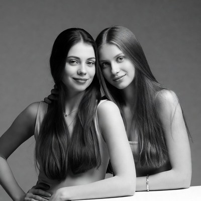 Two young women smiling together
