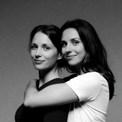 Two women hugging closely