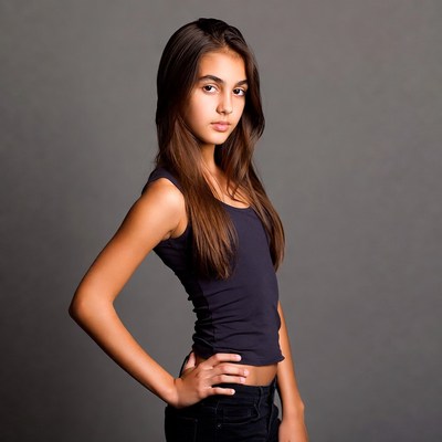 Teen girl posing with hand on hip