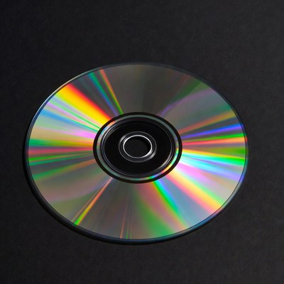 Shiny CD Disc on Black Background