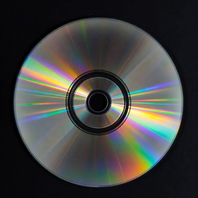 Shiny CD Disc on Black Background