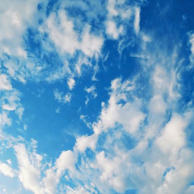Fluffy Clouds in Blue Sky