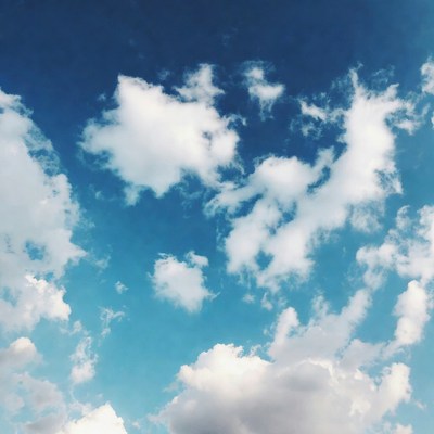 Fluffy White Clouds in Blue Sky