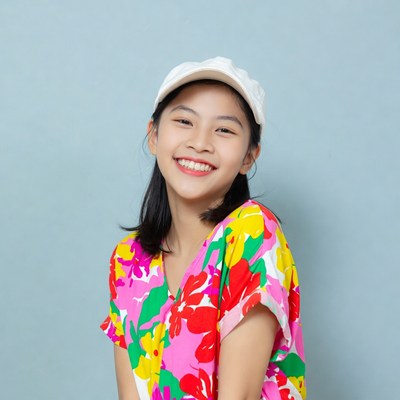 Asian girl smiling in floral shirt
