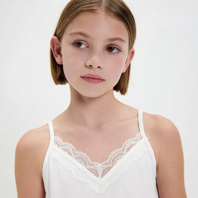 Girl in white lace camisole