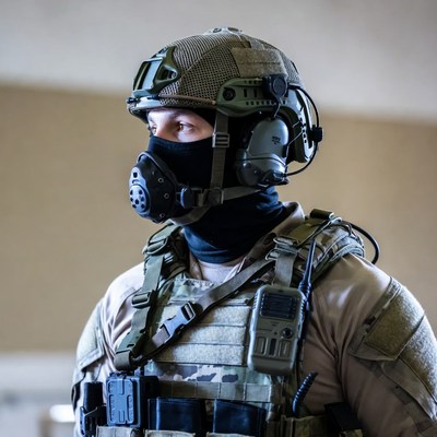 Soldier in tactical gear with gas mask