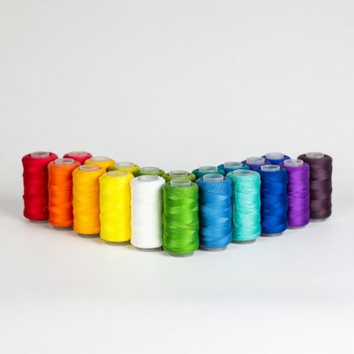 Colorful Spools of Thread Arranged in Heart