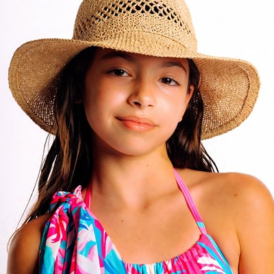Girl in straw hat and pink swimsuit