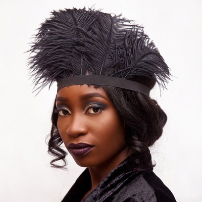 African woman in black feather headband