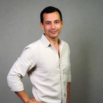 Man in white shirt smiling