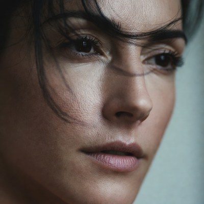 Close-up portrait of woman with dark hair