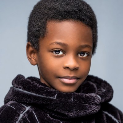 African-American boy in black fur collar