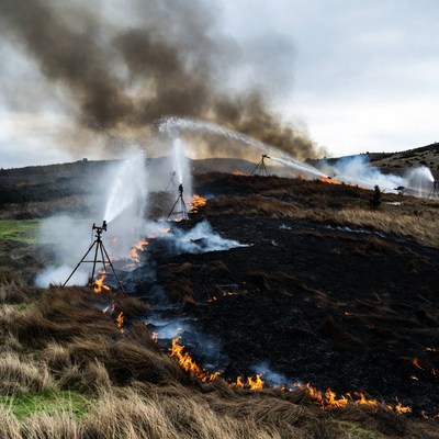 Fire Sprinklers Extinguishing Grassland Fire
