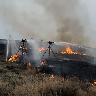 Tripod water cannons fighting wildfire