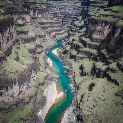 Turquoise River in Layered Canyon