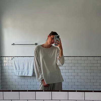 Woman taking bathroom selfie