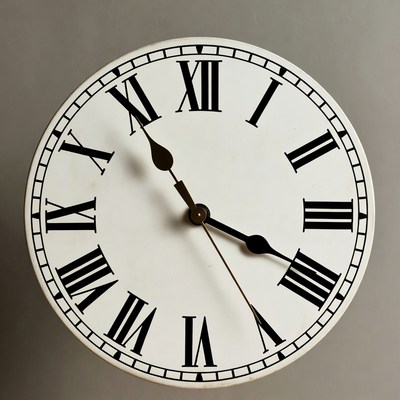 White Roman numeral wall clock