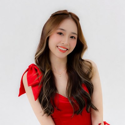 Asian woman in red dress smiling
