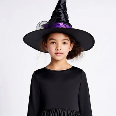 Girl wearing witch hat costume
