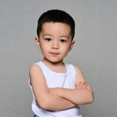 Asian boy with arms crossed