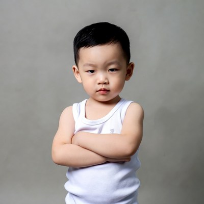 Asian boy arms crossed