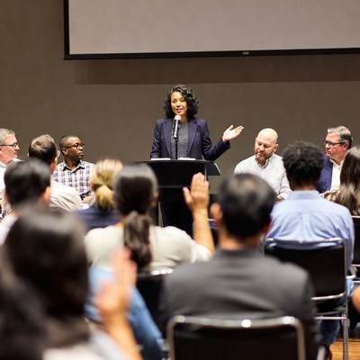 African-American woman speaking at conference