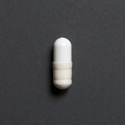 White capsule on black background