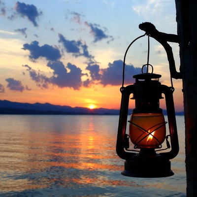 Lantern Hanging by Lake Sunset
