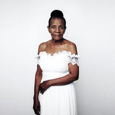 Elderly African woman in white lace dress