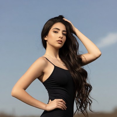 Woman with long hair hand on head