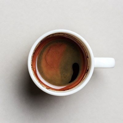 Top view of coffee in white cup
