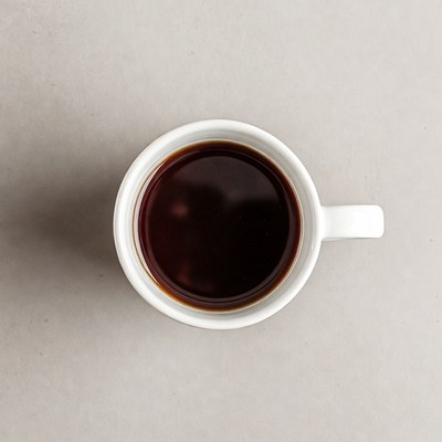 Top view of coffee in white mug
