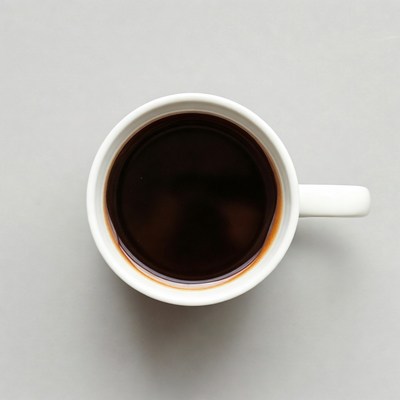 Top view of coffee in white mug