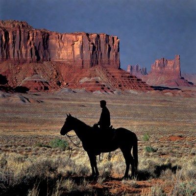 Cowboy on Horse Silhouette Monument Valley