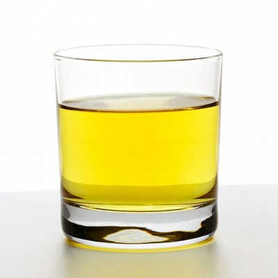 Glass of yellow liquid