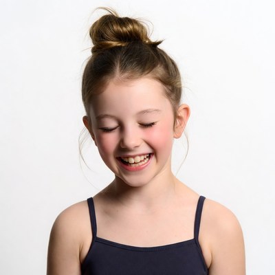 Smiling girl with bun hairstyle